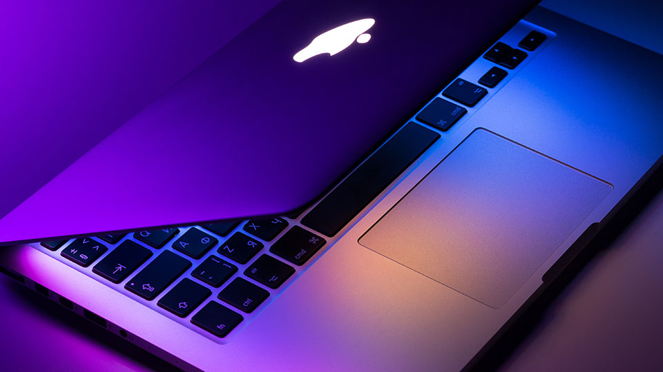 MacBook Pro computer with decorative lighting