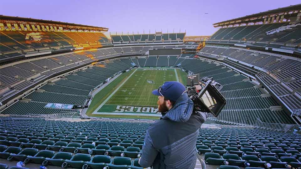 Cameraman in Philadelphia Eagles stadium.