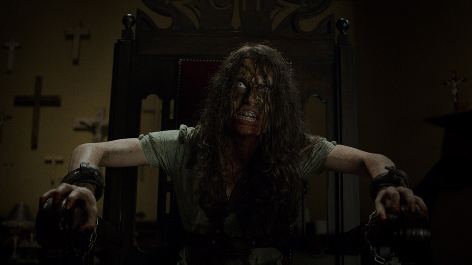 A possessed woman in a chair.