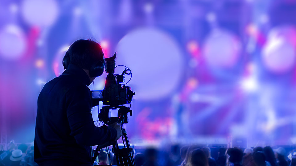 videographer recording live concert event