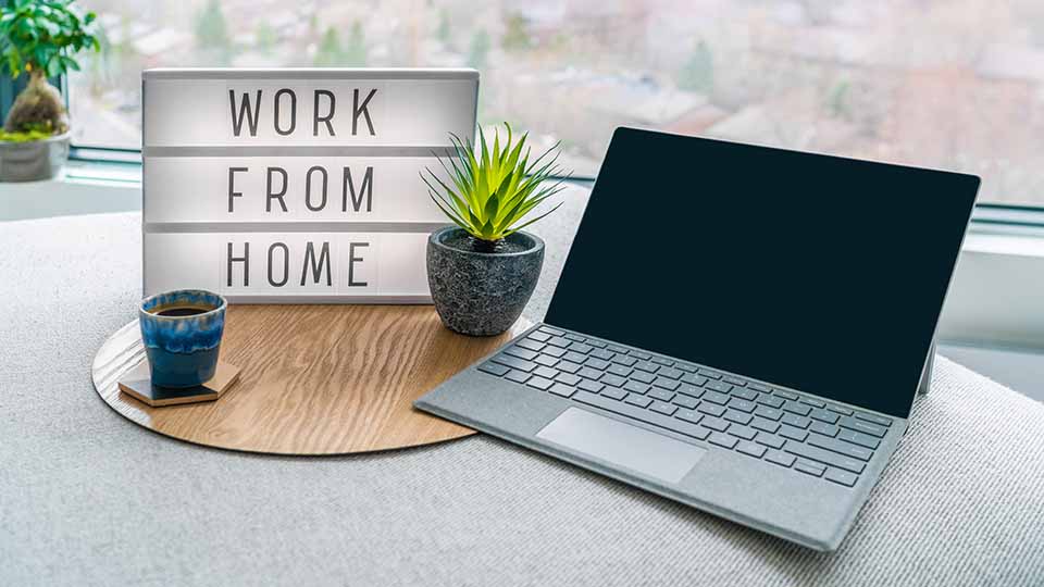 work from home sign and laptop for remote job